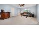 Comfortable living room with a ceiling fan, sofa, and a decorative table on the carpeted floor at 3810 Yorkford Dr, Charlotte, NC 28269