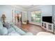 Cozy living room featuring hardwood floors, natural light, and a comfortable couch at 3810 Yorkford Dr, Charlotte, NC 28269