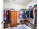 Spacious walk-in closet with built-in shelving, drawers, and plenty of hanging storage for clothes and shoes at 3810 Yorkford Dr, Charlotte, NC 28269