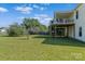 Home with large, green, grassy backyard, covered porch, and well-maintained landscaping at 4111 Alexis Sw Ct, Concord, NC 28027