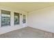 A sheltered back porch with a painted wood floor at 4111 Alexis Sw Ct, Concord, NC 28027