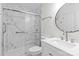 Bathroom with marble shower and white vanity at 4111 Alexis Sw Ct, Concord, NC 28027