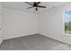 A room with carpet, ceiling fan, and a window at 4111 Alexis Sw Ct, Concord, NC 28027