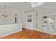 Inviting space featuring hardwood floors, and a bright and open floor plan with modern light fixtures at 4111 Alexis Sw Ct, Concord, NC 28027