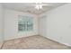 Inviting bedroom with a ceiling fan, natural light, and ample closet space at 4263 Melrose Club Dr, Matthews, NC 28105