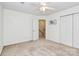 Spacious bedroom featuring a ceiling fan, closet and neutral carpeting at 4263 Melrose Club Dr, Matthews, NC 28105