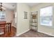 Charming dining nook featuring a decorative wall rack, farmers market art, and ample natural light at 4263 Melrose Club Dr, Matthews, NC 28105