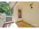 Side entry of a well-maintained home with a white picket fence at 4263 Melrose Club Dr, Matthews, NC 28105
