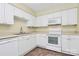 Clean kitchen featuring white cabinets, tiled floors, and stainless appliances at 4263 Melrose Club Dr, Matthews, NC 28105