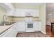 Bright kitchen with white cabinets, tile floors, and stainless appliances at 4263 Melrose Club Dr, Matthews, NC 28105