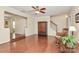 Open-concept living room features hardwood floors, a staircase, and a rocking chair, combining comfort with functional design at 4263 Melrose Club Dr, Matthews, NC 28105