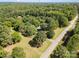 Aerial view of the property shows it is nestled among trees in a partially wooded area at 4612 Rehobeth Rd, Waxhaw, NC 28173