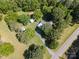 Aerial view of a charming home on a sprawling lot with lush greenery and several outbuildings at 4612 Rehobeth Rd, Waxhaw, NC 28173