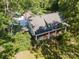 Charming home with a covered front porch, a brick chimney, and surrounded by lush trees and greenery at 4612 Rehobeth Rd, Waxhaw, NC 28173