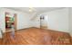 Bright living room with hardwood floors, arched doorways, and open layout, offering ample space for furniture and decor at 4612 Rehobeth Rd, Waxhaw, NC 28173