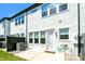 White brick exterior of a home with a small patio and grassy area at 4714 Blanchard Way, Charlotte, NC 28226