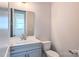 Neutral bathroom with a single sink vanity, toilet, and large mirror at 4714 Blanchard Way, Charlotte, NC 28226