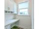 Bright office nook with built-in cabinets, desk and natural light from the window at 4714 Blanchard Way, Charlotte, NC 28226