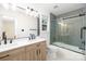 Beautiful bathroom featuring a double vanity, tiled shower, and tile flooring at 4808 Cobble Glen Way, Charlotte, NC 28269