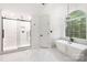 Luxurious bathroom featuring a standalone tub, glass shower, and elegant fixtures at 4808 Cobble Glen Way, Charlotte, NC 28269