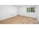 Bright bedroom featuring a window allowing for natural light and LVP flooring at 4808 Cobble Glen Way, Charlotte, NC 28269