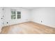 Bright bedroom featuring a window allowing for natural light and LVP flooring at 4808 Cobble Glen Way, Charlotte, NC 28269