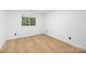 Bedroom featuring a window allowing for natural light and LVP flooring at 4808 Cobble Glen Way, Charlotte, NC 28269