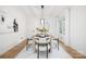 Modern dining room with a bright color palette, contemporary lighting, and seating for six at 4808 Cobble Glen Way, Charlotte, NC 28269