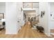 Open foyer with hardwood floors, staircase, and a view into the living spaces at 4808 Cobble Glen Way, Charlotte, NC 28269
