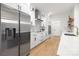 Modern kitchen features stainless steel appliances and stylish white cabinets at 4808 Cobble Glen Way, Charlotte, NC 28269