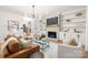Inviting living room with a fireplace, built-in shelving, and stylish decor at 4808 Cobble Glen Way, Charlotte, NC 28269