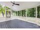 Relaxing screened porch with ceiling fan and view of the lush greenery, a great outdoor space at 4808 Cobble Glen Way, Charlotte, NC 28269