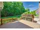 Inviting back deck overlooking a lush green lawn and well-maintained landscaping at 5008 Woodview Ln, Weddington, NC 28104