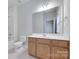 Bathroom featuring an updated vanity, large mirror and combination shower and tub at 5008 Woodview Ln, Weddington, NC 28104