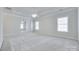 Bright bedroom with a ceiling fan, large windows and neutral colors at 5008 Woodview Ln, Weddington, NC 28104