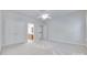 Bright bedroom featuring neutral paint and carpet with a doorway to another room and double closet at 5008 Woodview Ln, Weddington, NC 28104