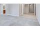 Spacious room features neutral paint and patterned carpet with entrance to multiple rooms at 5008 Woodview Ln, Weddington, NC 28104