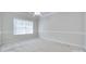 Bright bedroom featuring a large window with natural light and neutral decor at 5008 Woodview Ln, Weddington, NC 28104