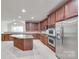 Well-equipped kitchen features stainless steel appliances, a central island, and plenty of counter space at 5008 Woodview Ln, Weddington, NC 28104