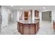View of the Kitchen Island and the adjacent rooms on the home's main level at 5008 Woodview Ln, Weddington, NC 28104