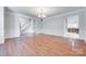 Spacious living area with hardwood floors, decorative molding, and elegant chandelier for a refined look at 5008 Woodview Ln, Weddington, NC 28104