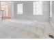 Bright living area with patterned carpet, classic trim, and large windows offering abundant light at 5008 Woodview Ln, Weddington, NC 28104