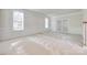 Bright living area with patterned carpet, classic trim, and large windows offering abundant light at 5008 Woodview Ln, Weddington, NC 28104