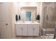 Bathroom featuring double vanity, a glass shower with a built-in seat, and tile flooring at 508 Tayberry Ln, Fort Mill, SC 29715