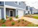 Inviting townhome featuring a well-maintained front yard and convenient one-car garage at 508 Tayberry Ln, Fort Mill, SC 29715