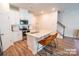 Well-lit kitchen features granite countertops, stainless appliances and an island with bar seating at 508 Tayberry Ln, Fort Mill, SC 29715