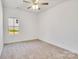Bedroom featuring neutral carpet and a window that provides natural light at 5175 Grand Canyon Rd, Concord, NC 28027