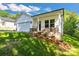 Charming exterior showcasing a one-car garage, black trim, and a manicured lawn at 5175 Grand Canyon Rd, Concord, NC 28027