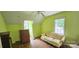 Bedroom with a light green walls and a ceiling fan at 600 College Ave, Rock Hill, SC 29730