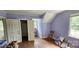 Bright bedroom featuring hardwood floors, ample closet space, and a serene view from the window at 600 College Ave, Rock Hill, SC 29730